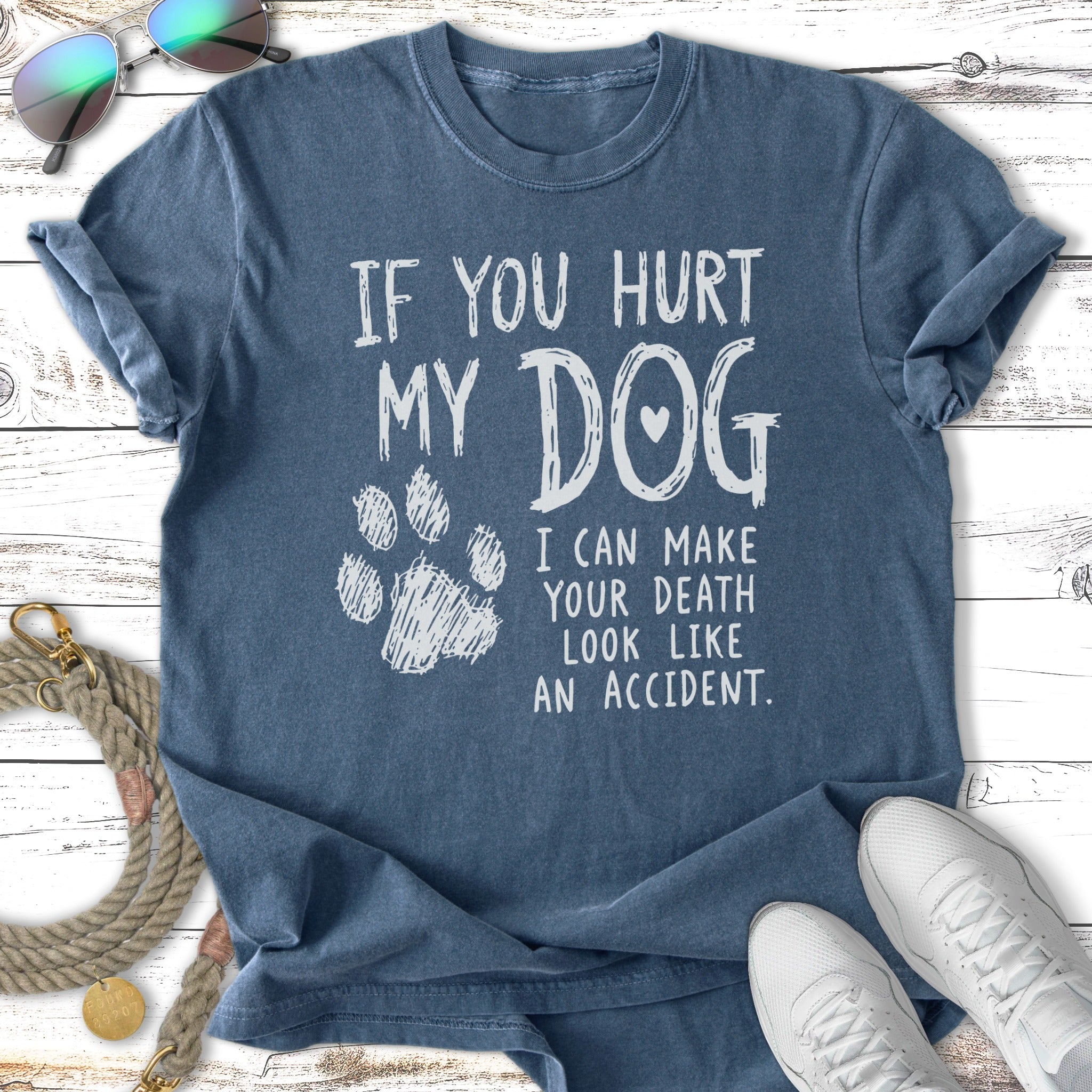 T-shirt with "If you hurt my dog" text and paw print.