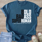 Blue t-shirt with text "BOLD BADASS SUPERHUMAN ...and I like my dog more than people".