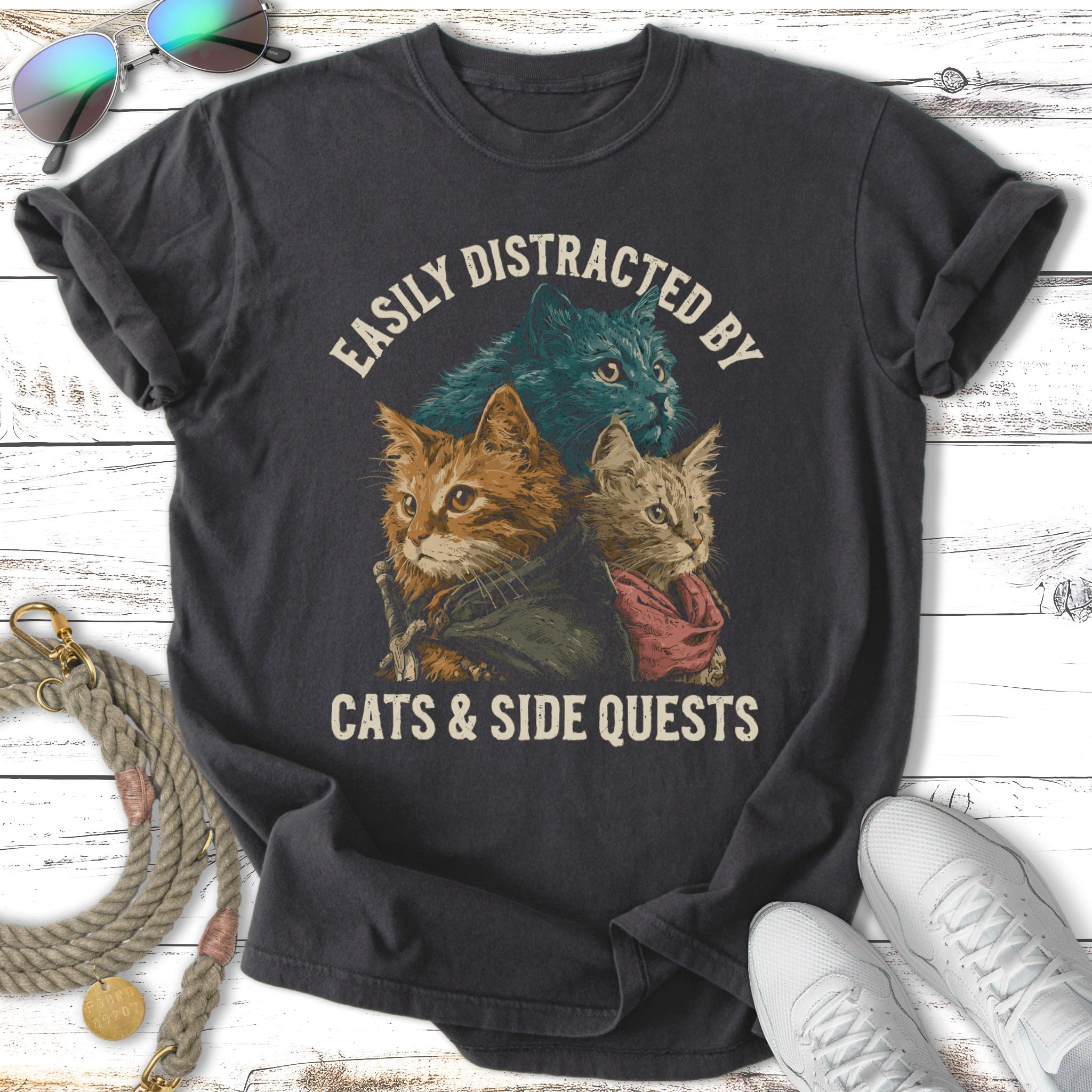 Graphic t-shirt with three cats and the text "EASILY DISTRACTED BY CATS & SIDE QUESTS".