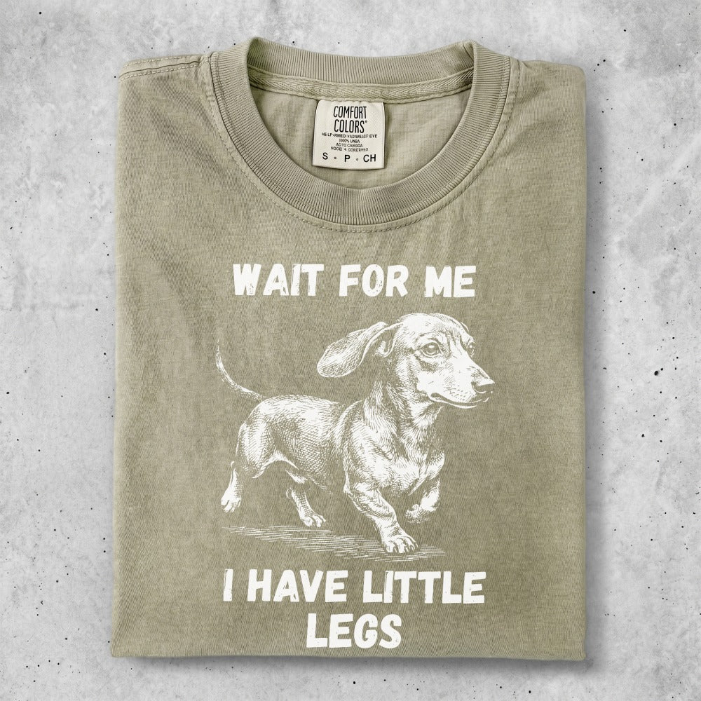 T-shirt with dachshund graphic and "WAIT FOR ME I HAVE LITTLE LEGS" text.