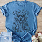 Blue t-shirt with "DAD TAX" text and golden retriever wearing sunglasses holding a drink and fries.