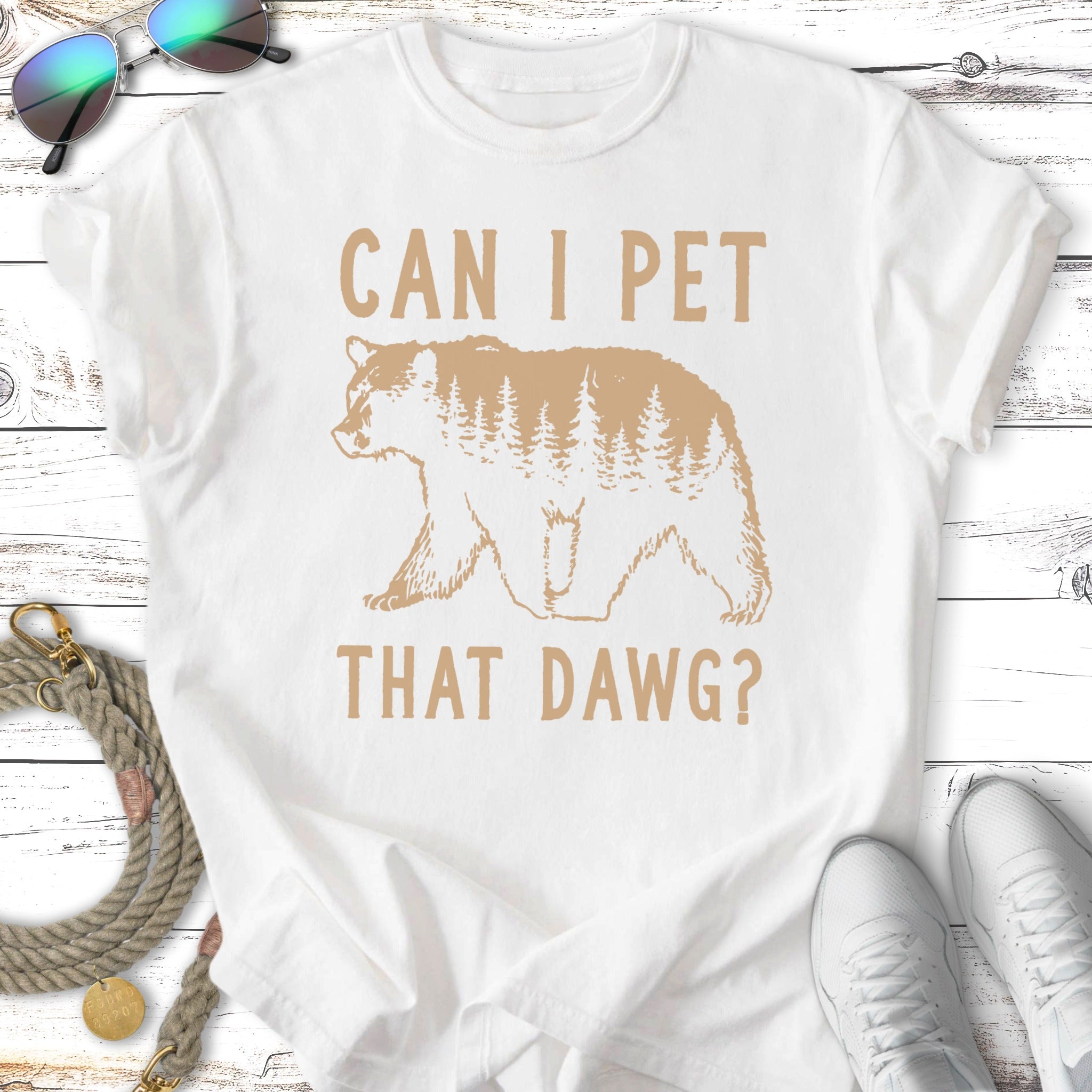White t-shirt with a bear silhouette and text that reads "CAN I PET THAT DAWG?".
