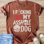 Brown t-shirt with text "I F*cking My Asshole Dog" and dog graphic.