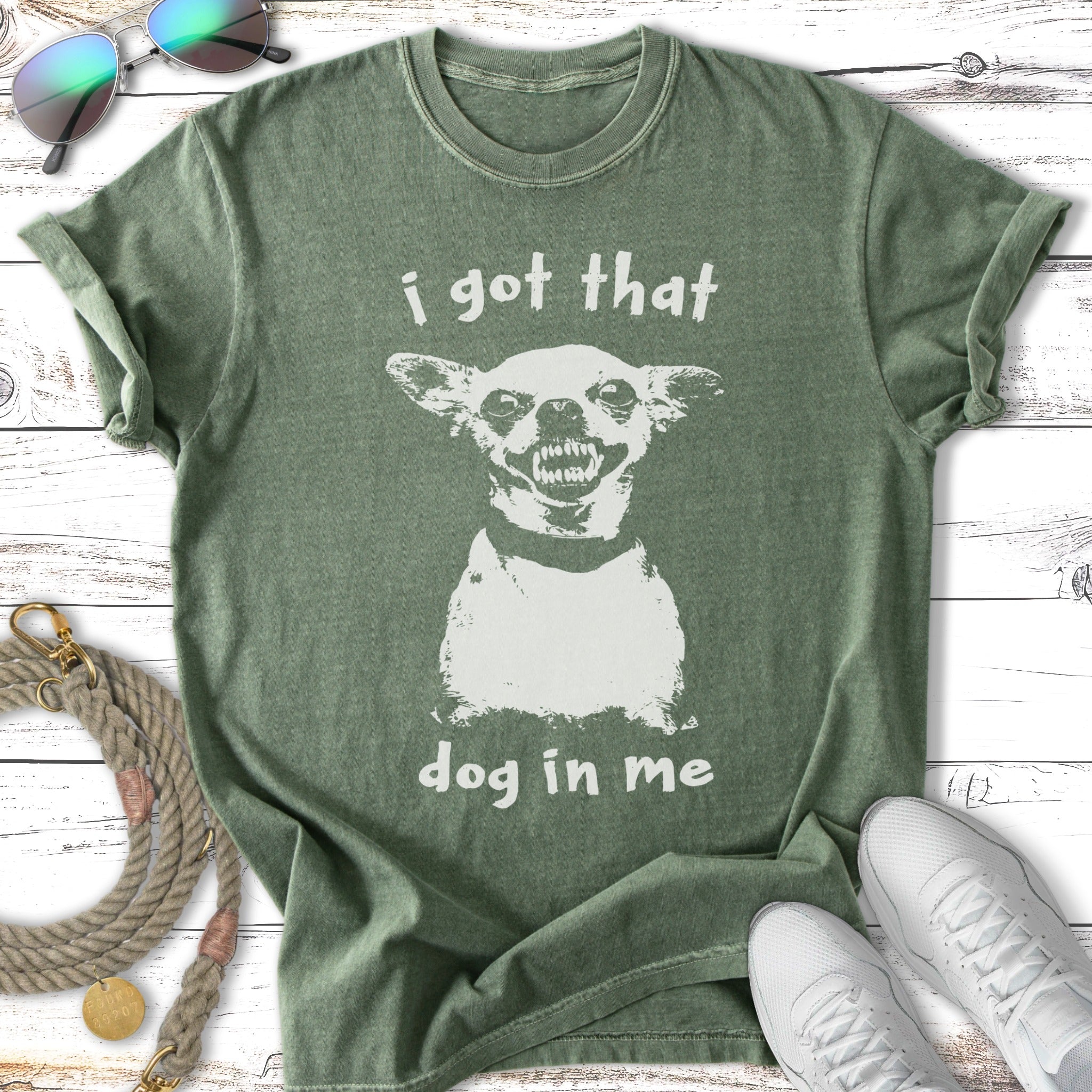 Green t-shirt with a distressed graphic of a snarling dog and text "i got that dog in me".