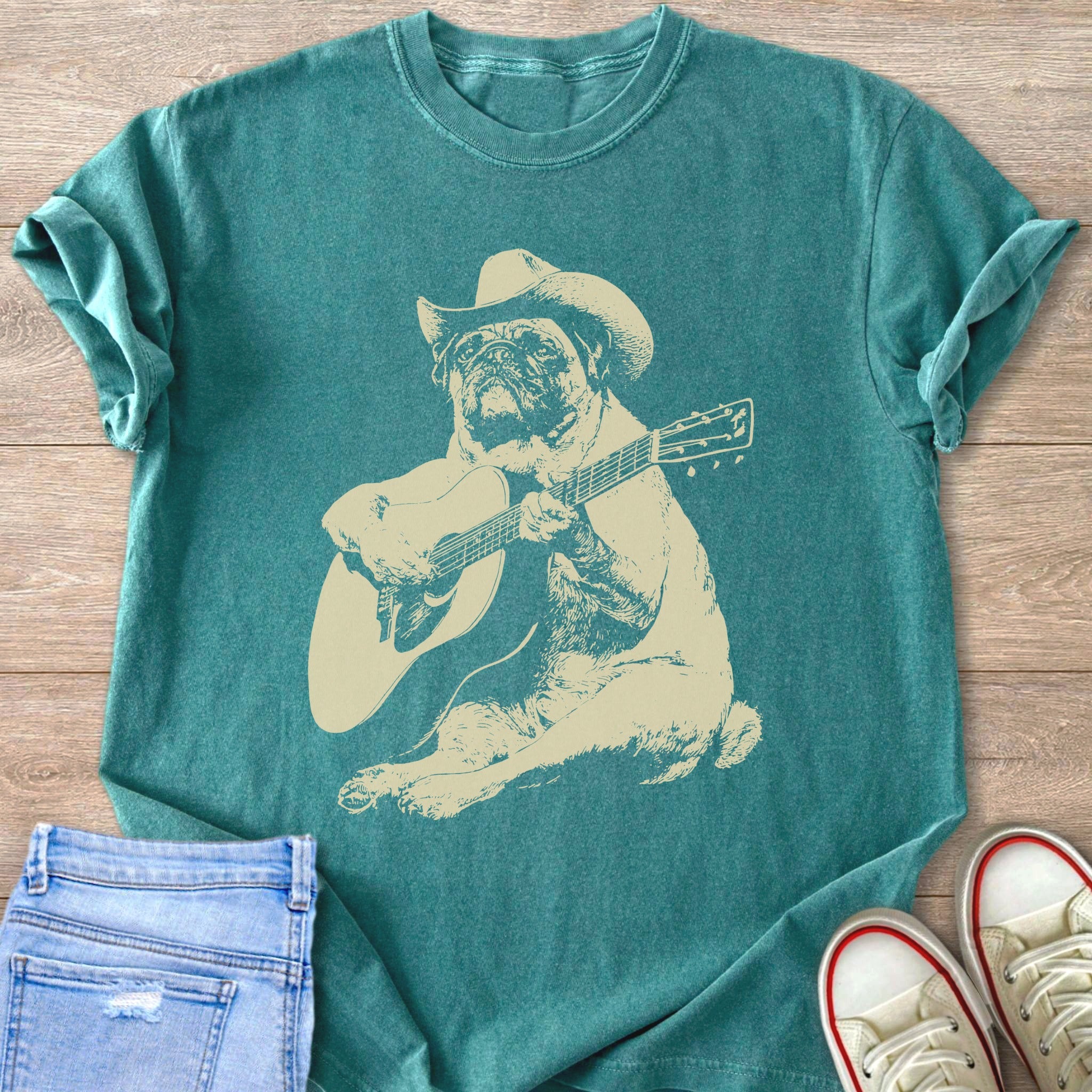 T-shirt with a pug wearing a cowboy hat playing a guitar.