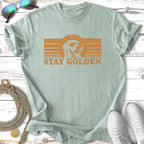 Light green t-shirt with "Stay Golden" text and sunglasses-wearing dog graphic.