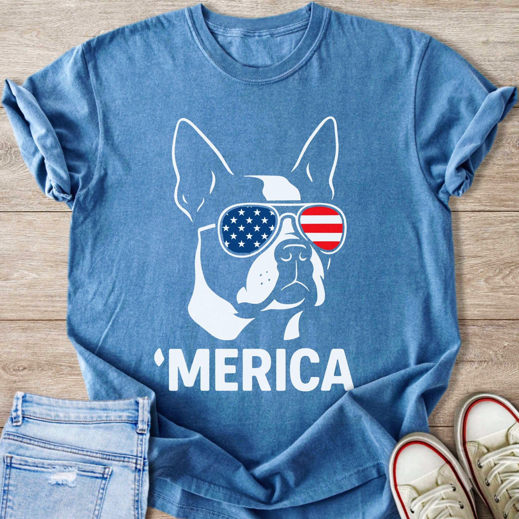 Blue t-shirt with white graphic of a dog wearing American flag sunglasses and the word 'MERICA.