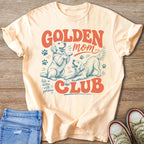 Light peach t-shirt with a distressed graphic of two golden retrievers, "Golden Mom Club," and "life is better with goldens."