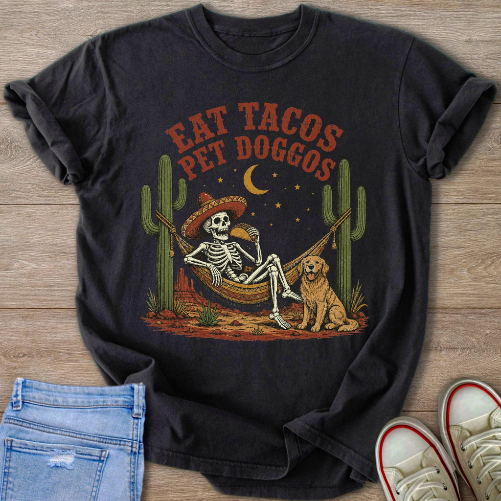 Skeleton in hammock with taco and dog, surrounded by cacti; text reads "Eat Tacos Pet Doggos".