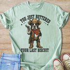 French bulldog in cowboy attire holding gun with text "YOU JUST BUTTERED YOUR LAST BISCUIT".