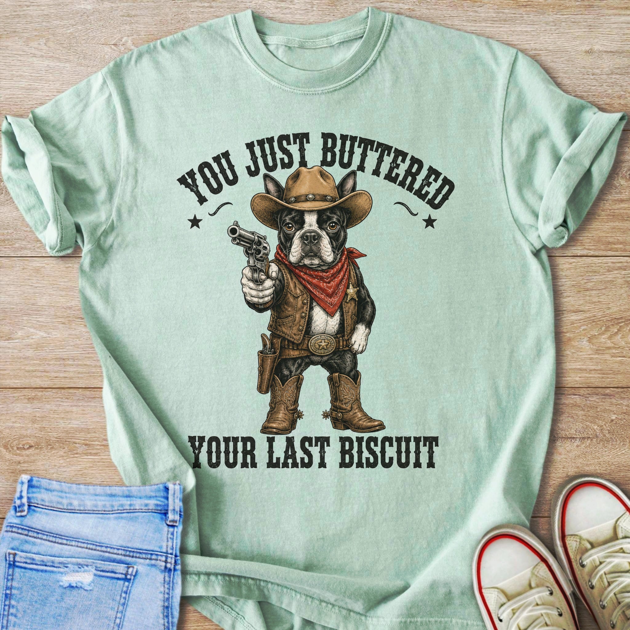 French bulldog in cowboy attire holding gun with text "YOU JUST BUTTERED YOUR LAST BISCUIT".
