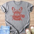 Grey t-shirt with a red French bulldog graphic holding a rose in its mouth.