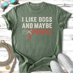 Green t-shirt with "I like dogs and maybe 2 people" text and paw print.