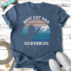 Best Cat Dad Ever graphic tee with a cat fist bumping a human.