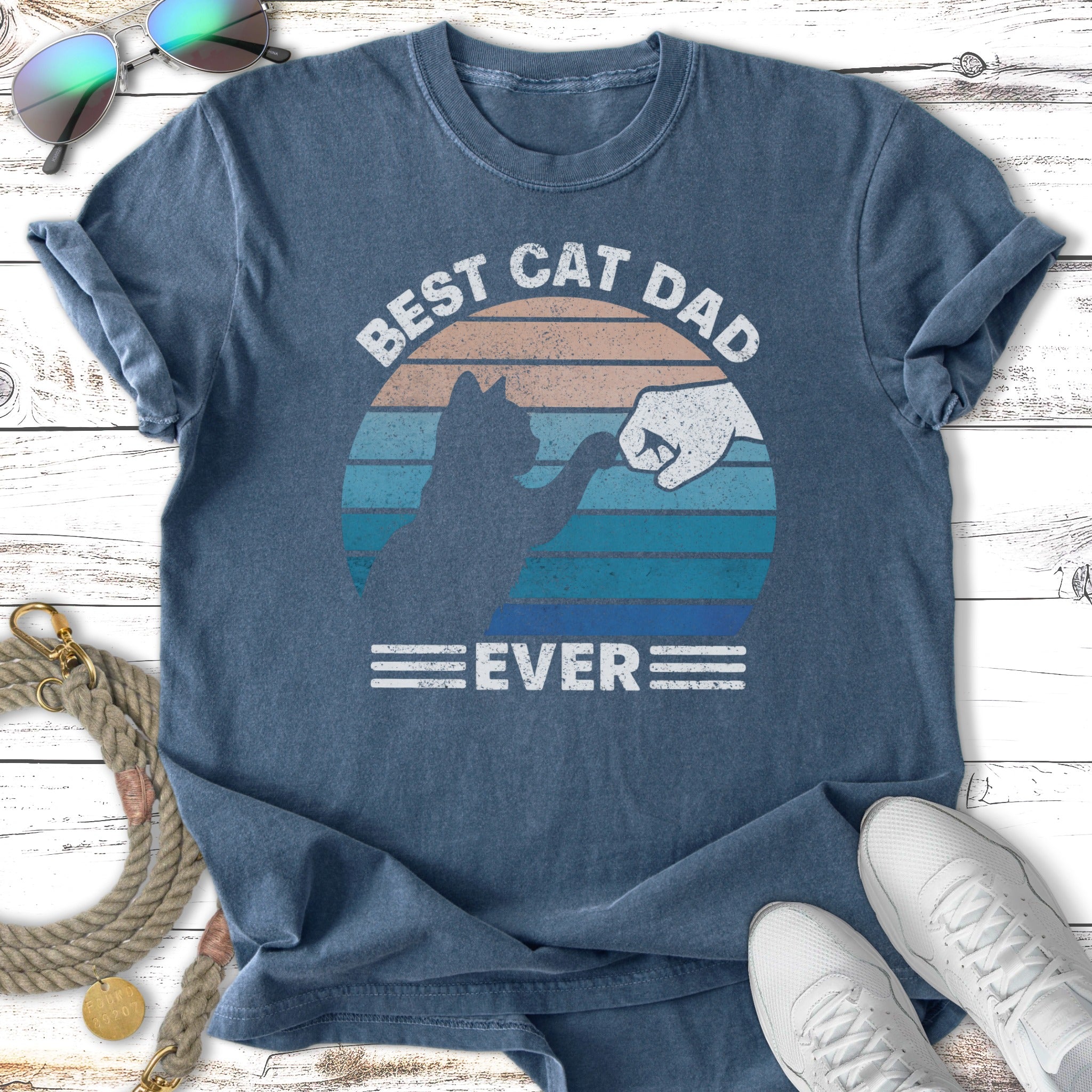 Best Cat Dad Ever graphic tee with a cat fist bumping a human.