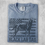 Blue t-shirt with a faded American flag and a silhouette of a Black Labrador.