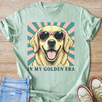 Golden retriever wearing sunglasses with textured background and text "IN MY GOLDEN ERA".