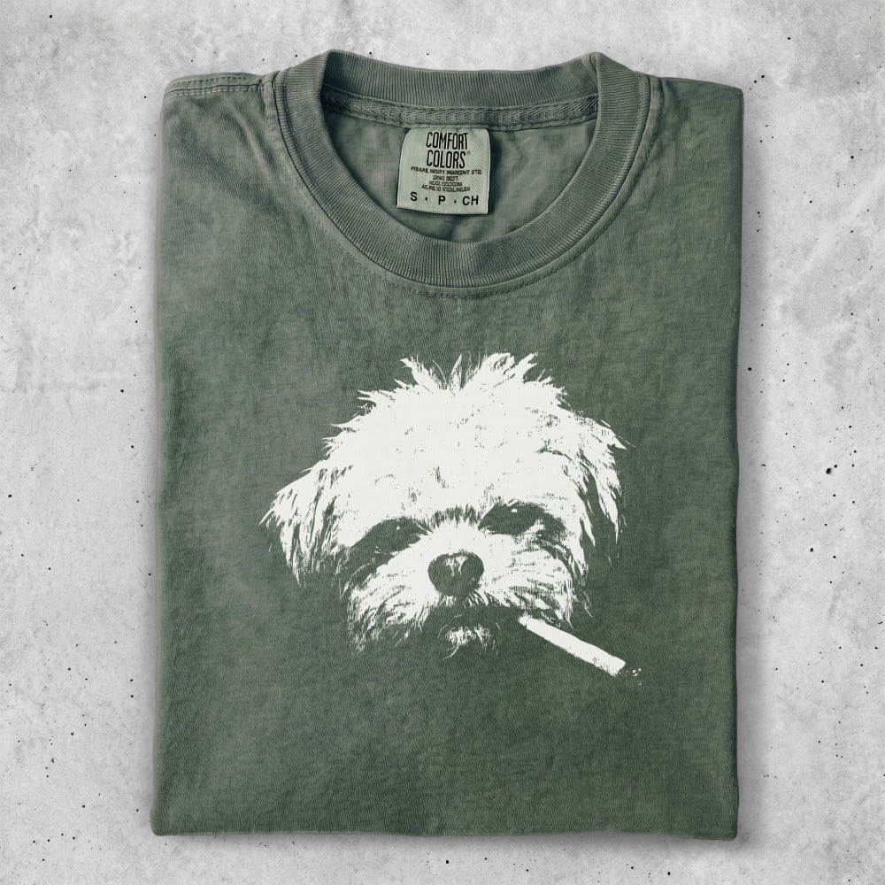 T-shirt with graphic of a shaggy white dog smoking a cigarette.