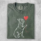 White outline French bulldog holding a red heart balloon.