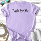 Lavender t-shirt with "Bark for Me" text, sunglasses, leash, and sneakers.