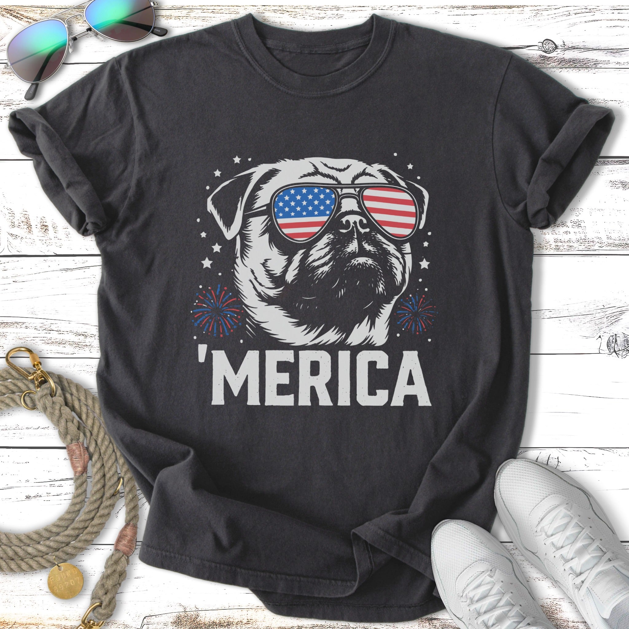 Black t-shirt with a pug wearing American flag sunglasses and "MERICA" text.