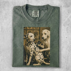 Two Dalmatians, one getting a tattoo, on a green t-shirt.