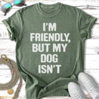 Green t-shirt with white text: "I'm friendly, but my dog isn't".