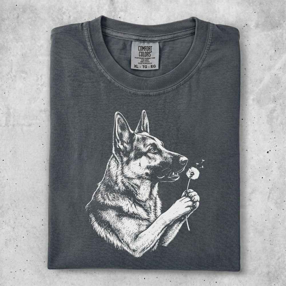 German Shepherd holding a dandelion puffball, Comfort Colors brand.