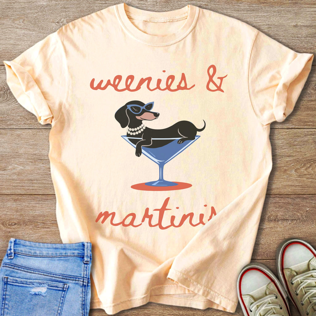 Peach t-shirt graphic with dachshund in martini glass saying "weenies & martinis".