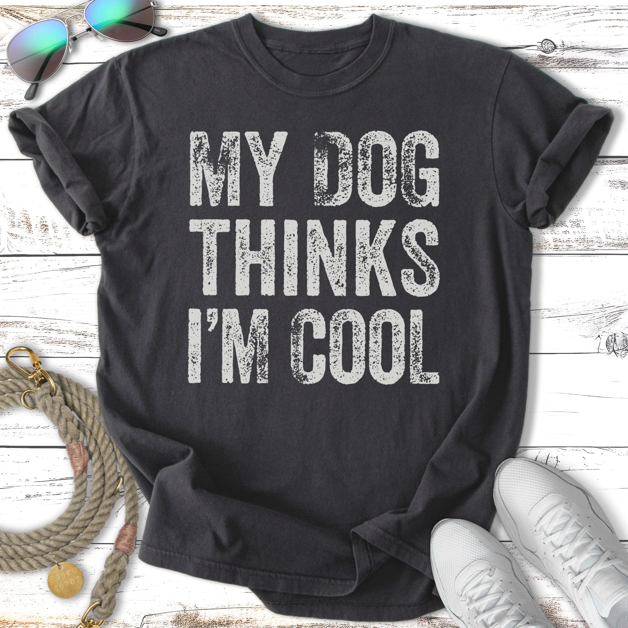Dark gray t-shirt with white text "MY DOG THINKS I'M COOL"