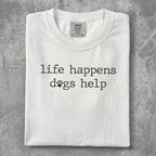 White t-shirt with "life happens dogs help" and dog paw print graphic.