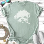 White dog wearing sunglasses with cigarette in mouth graphic on green t-shirt.