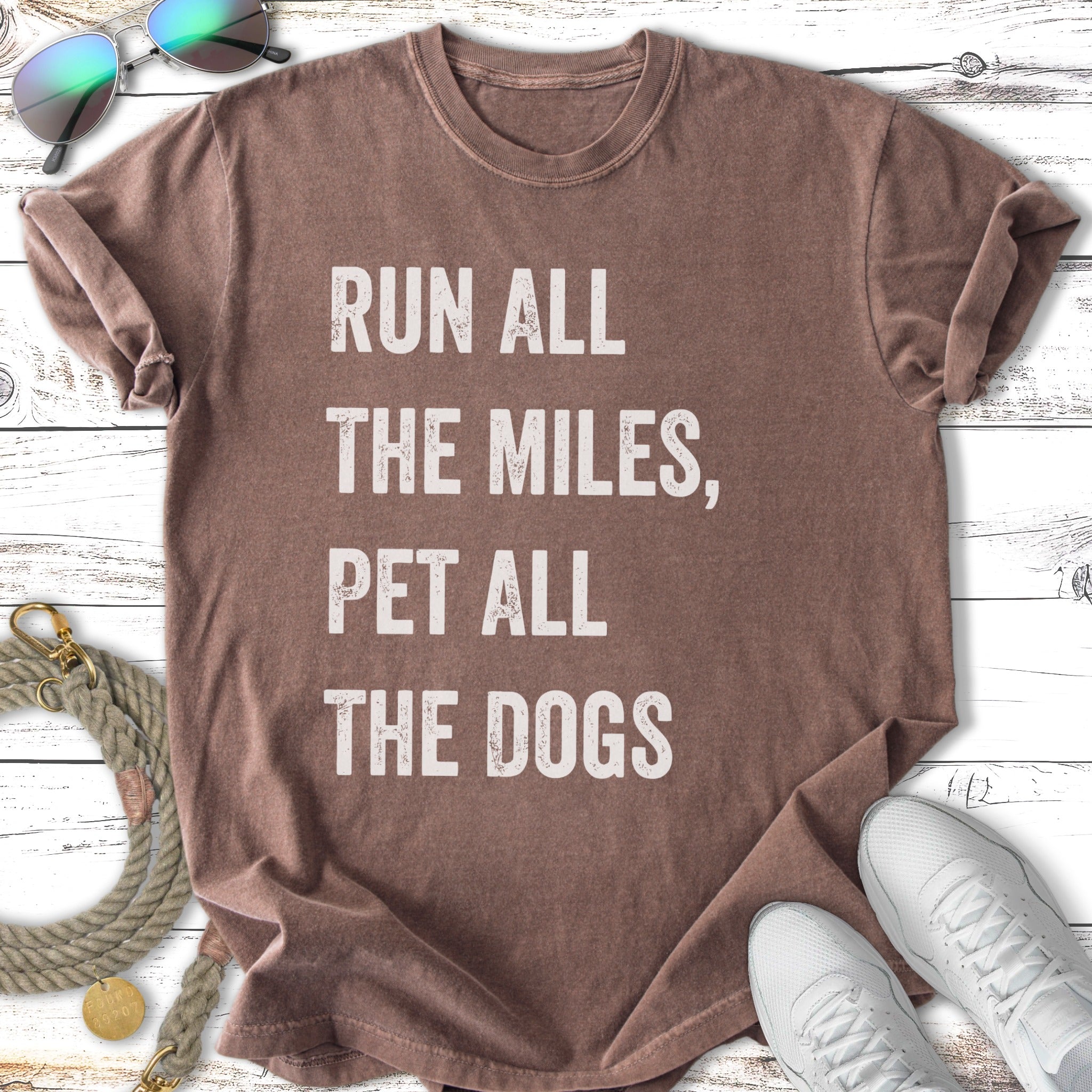 T-shirt with text "Run all the miles, pet all the dogs."