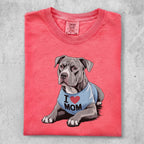 Pitbull wearing an "I Mom" shirt, cropped view.
