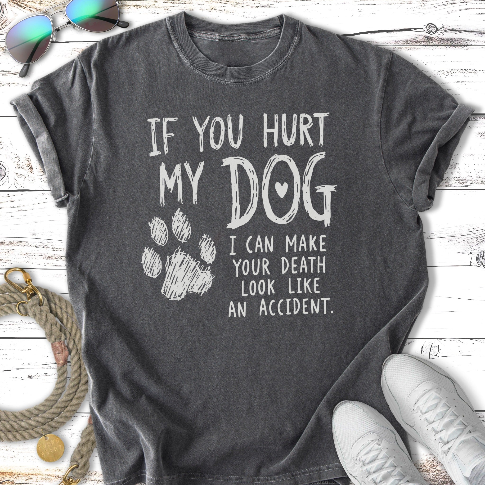 Dark t-shirt with white text and a paw print: "If you hurt my dog...".