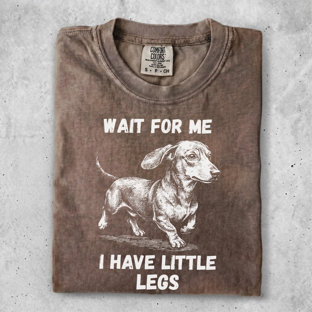T-shirt with graphic of a dachshund and text "WAIT FOR ME I HAVE LITTLE LEGS".