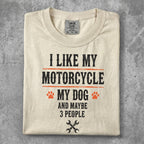 Cream t-shirt with "I like my motorcycle and dog" text and paw prints.