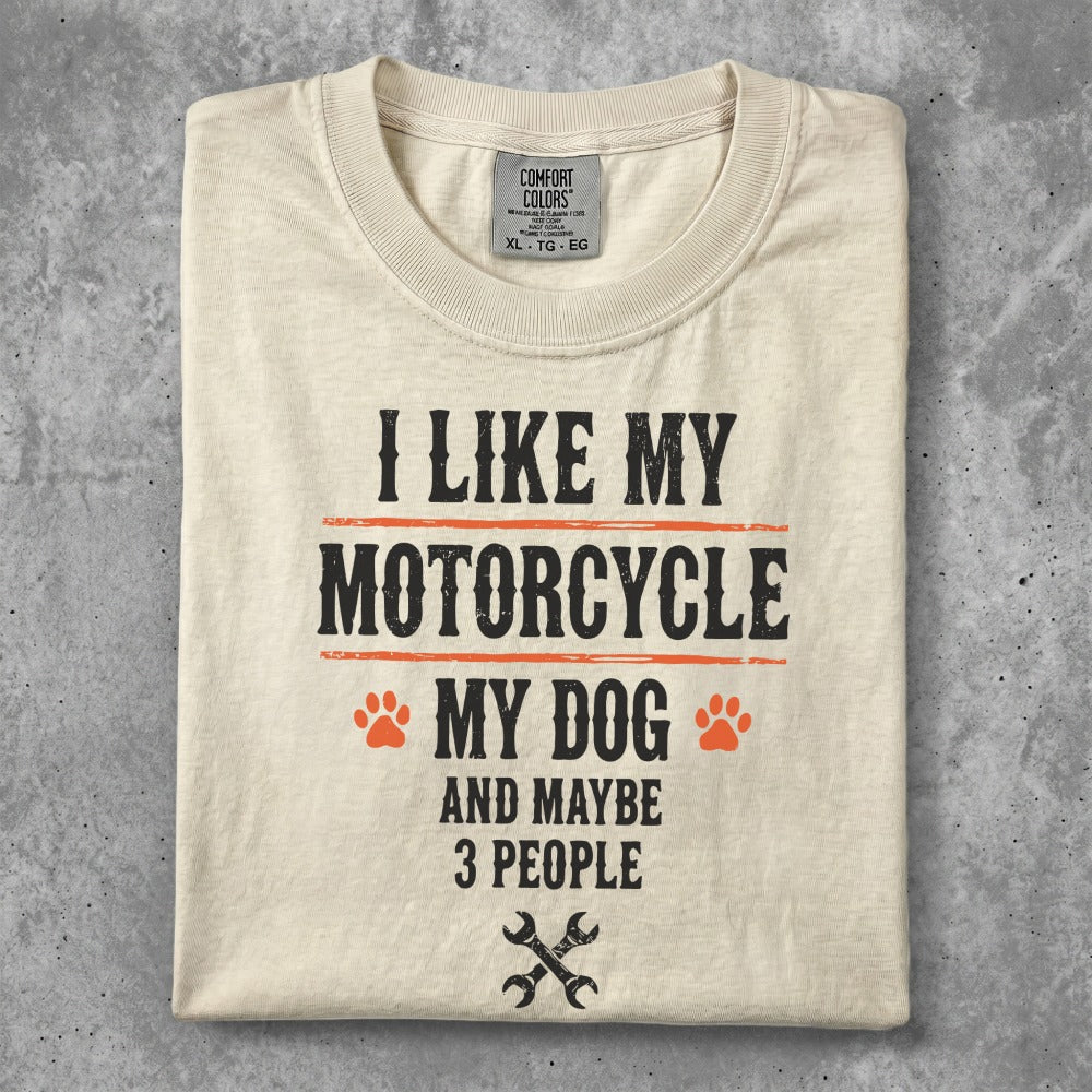 Cream t-shirt with "I like my motorcycle and dog" text and paw prints.
