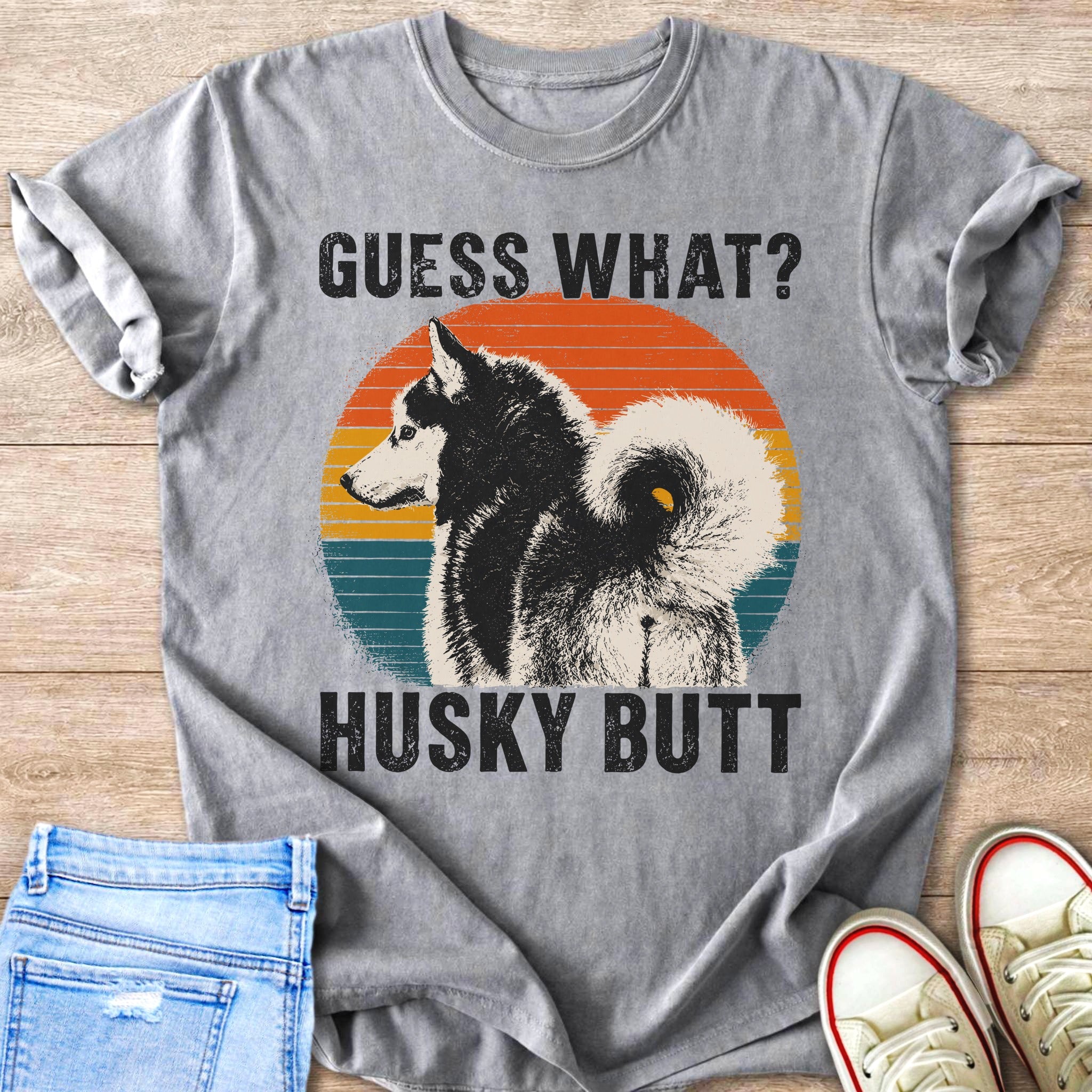 Gray t-shirt with the text "GUESS WHAT? HUSKY BUTT" and a husky illustration.