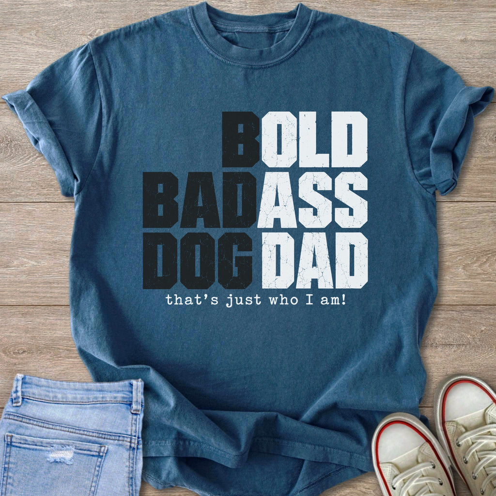 Blue t-shirt with "BOLD BADASS DOG DAD" and "that's just who I am!" text.