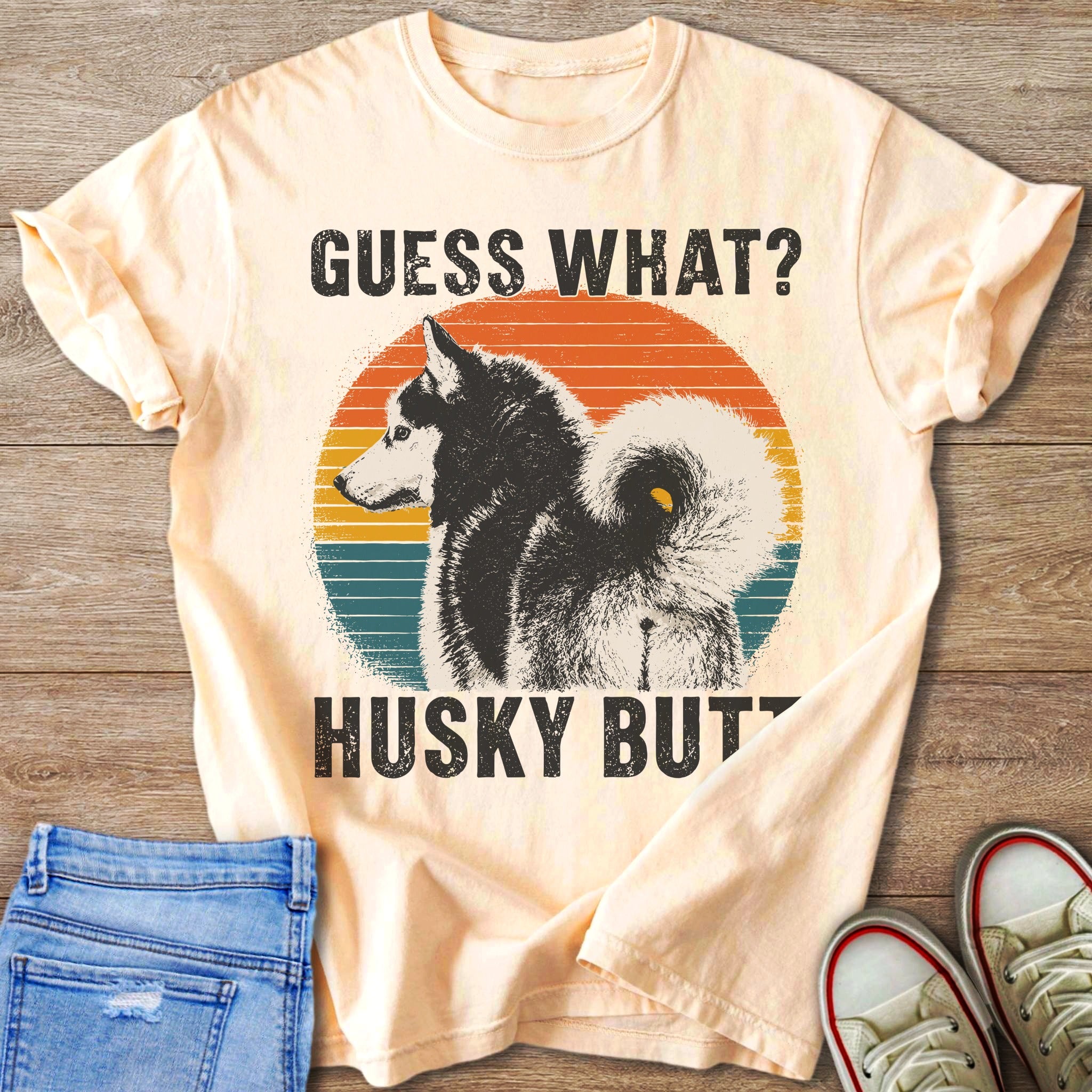Light peach t-shirt with vintage distressed husky graphic and text "Guess What? Husky Butt".