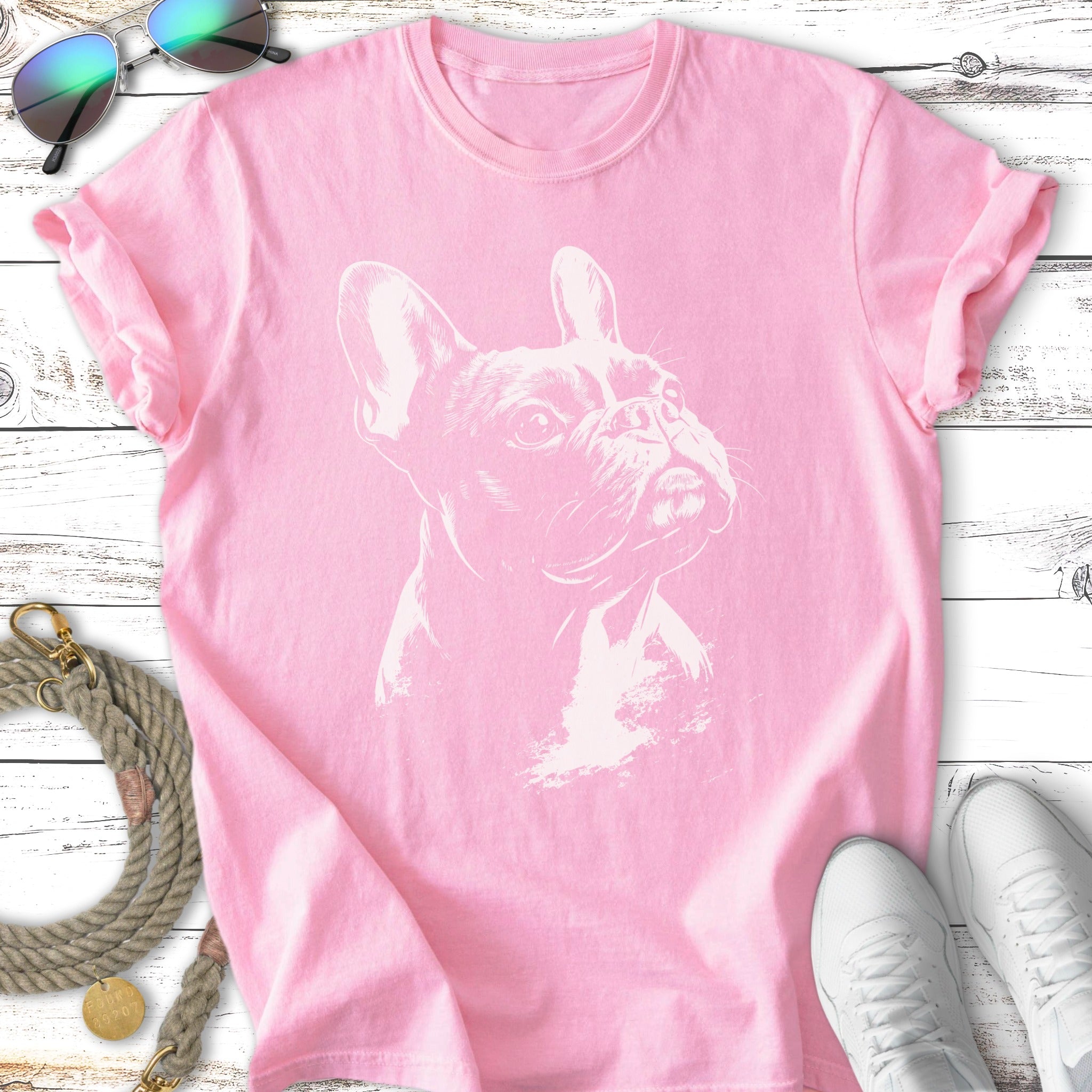 Pink t-shirt with a white outline drawing of a French bulldog.