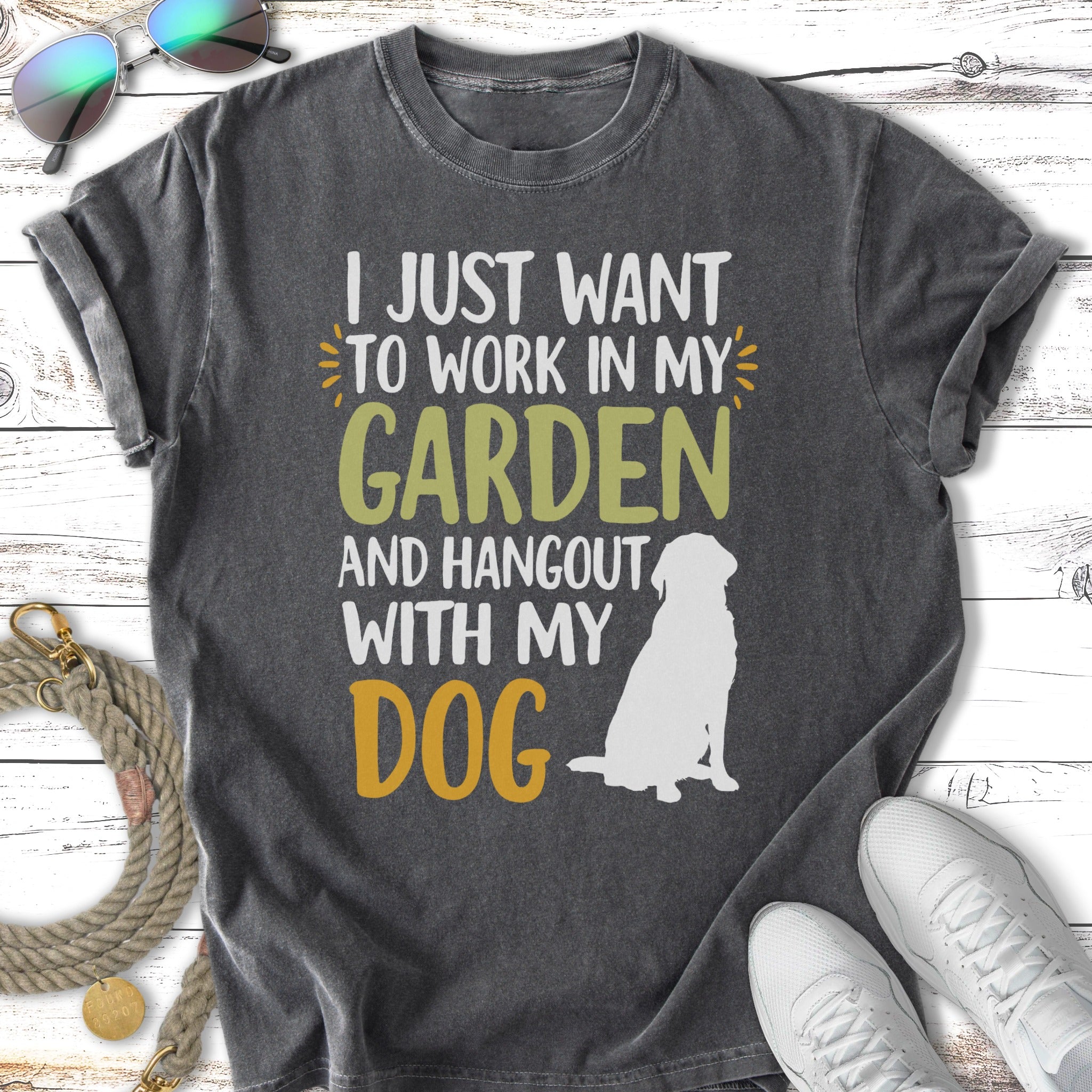 T-shirt with text "I JUST WANT TO WORK IN MY GARDEN AND HANGOUT WITH MY DOG" and a dog silhouette.