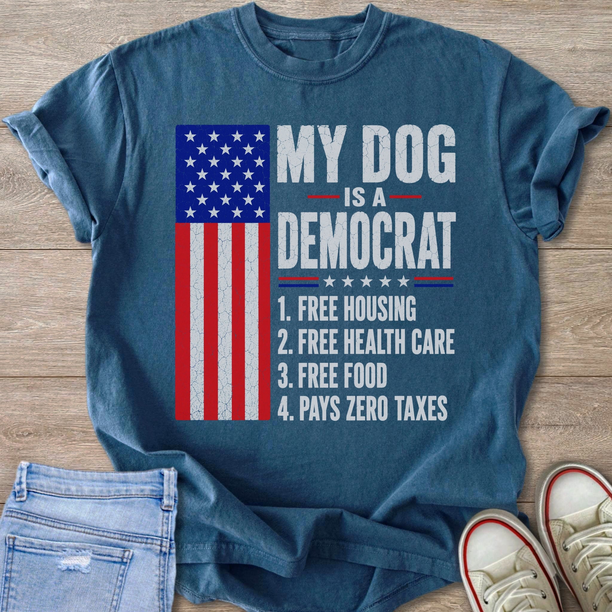Blue t-shirt with American flag graphic and text "My Dog is a Democrat" listing benefits.