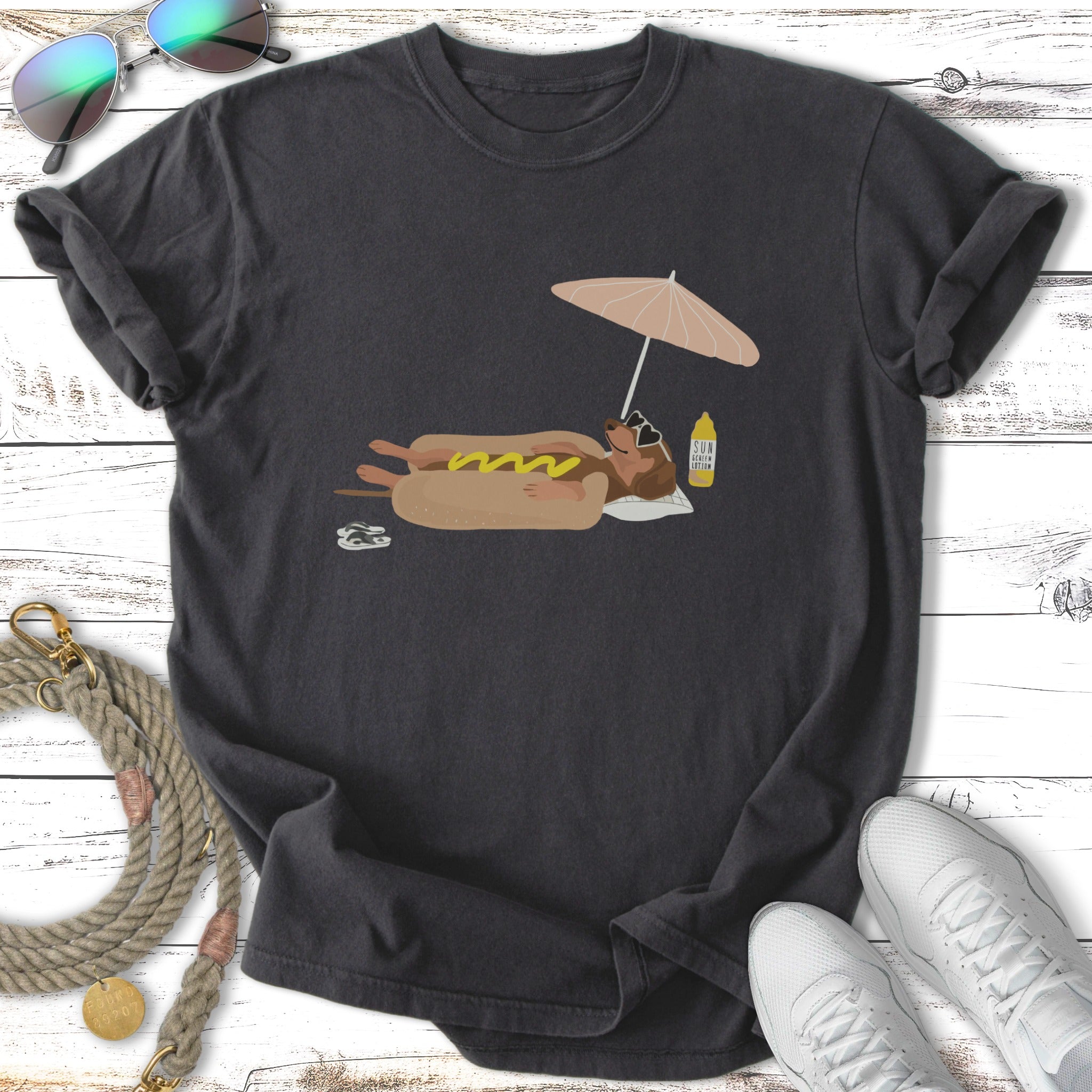 Dog on a hot dog with umbrella and sunscreen bottle.