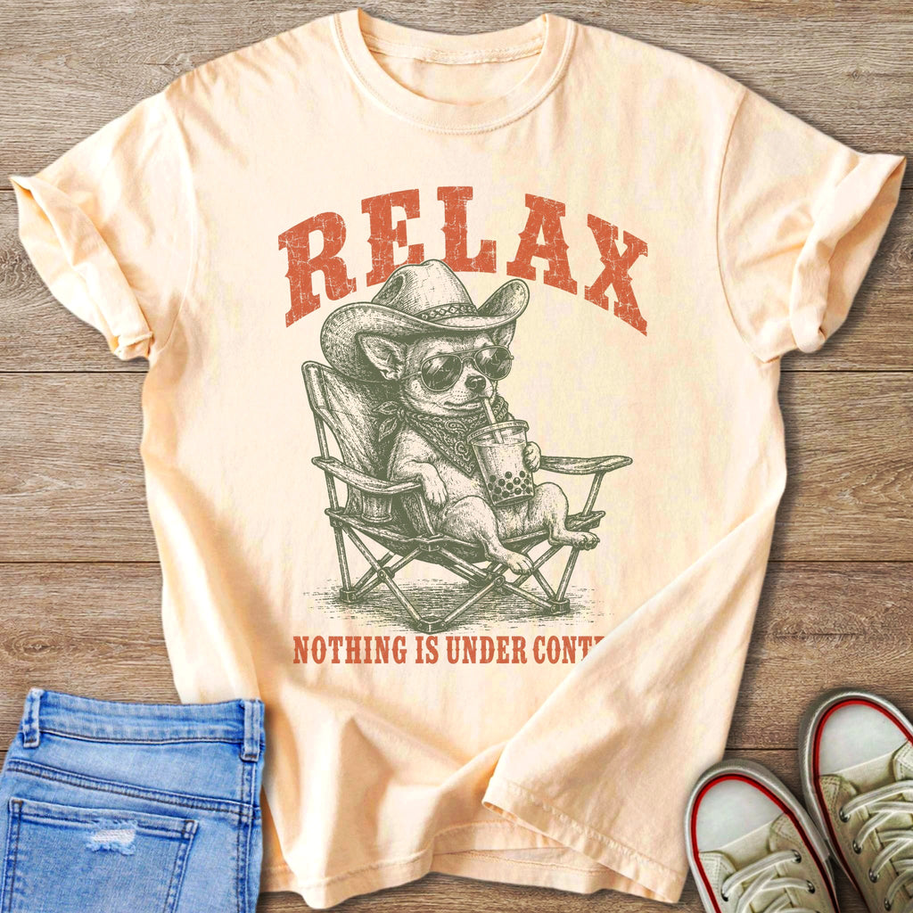 Peach t-shirt with graphic of dog in cowboy hat drinking bubble tea.