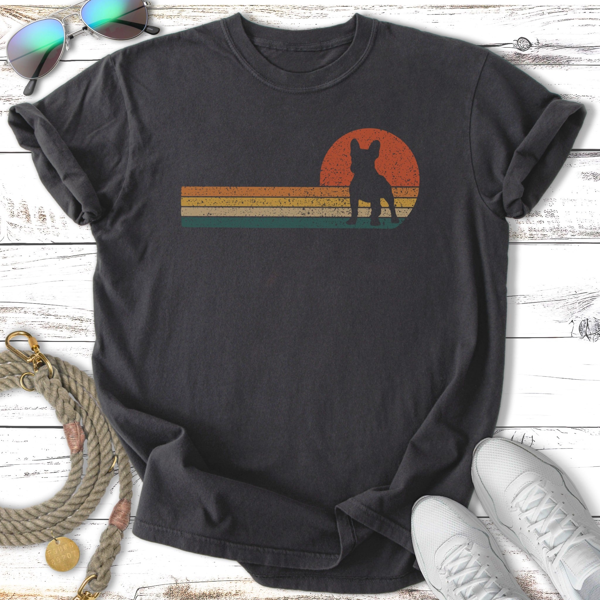 Dark t-shirt with vintage sunset graphic featuring a French Bulldog silhouette.