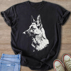 Black t-shirt with a white German Shepherd graphic on a wooden background.