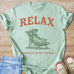 Green t-shirt with "RELAX" and a dachshund lounging in a chair.