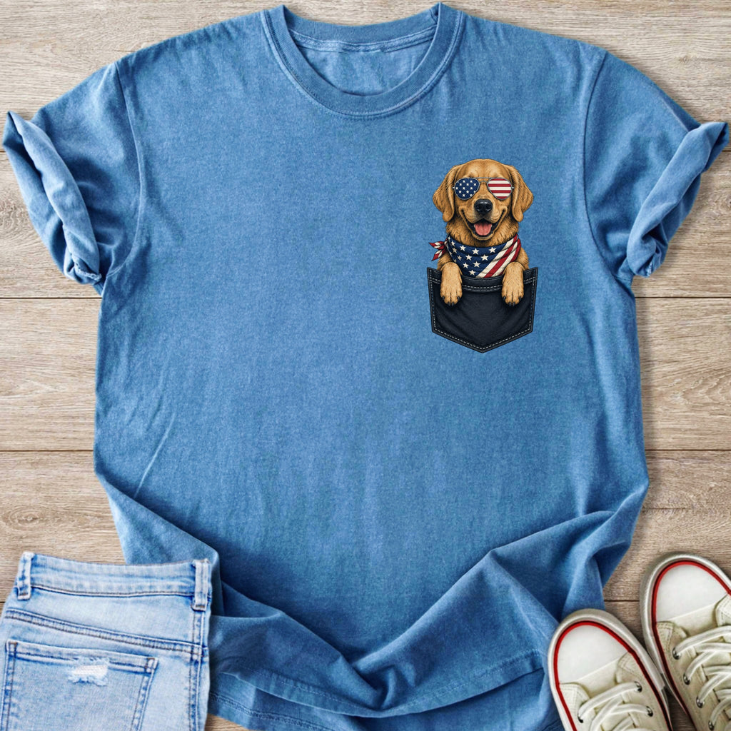 Golden retriever wearing American flag sunglasses and bandana peeking from a pocket.